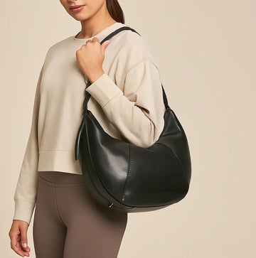 Solid Black Smooth Curved Bag with Thick Braided Leather Shoulder Strap for Minimalist Casual Athleisure Outfits
