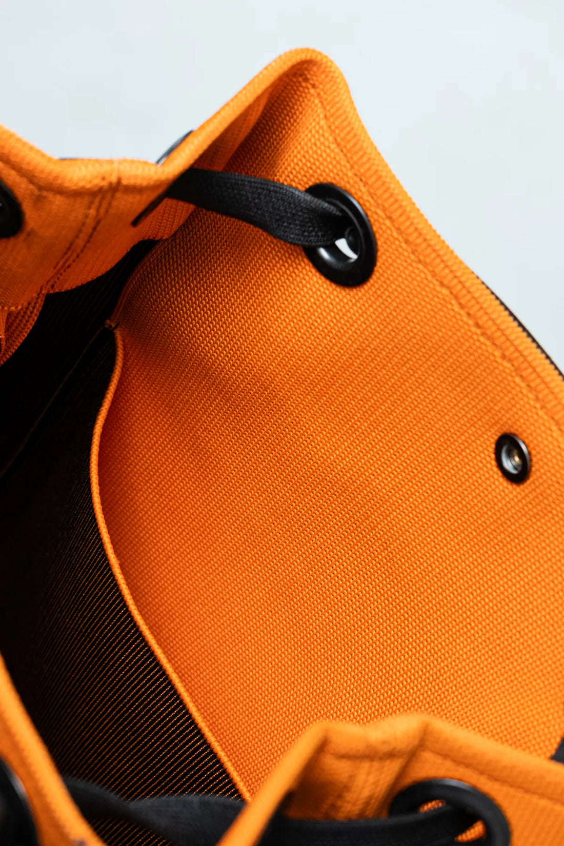 Vibrant Orange Trapezoid Drawstring Backpack Bag with Black Leather Trim & Dual-Use Webbing Straps